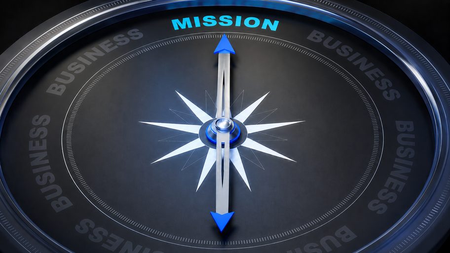 A compass needle pointing to Mission, on a dark business dial