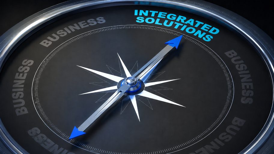 A compass needle pointing to Integrated Solutions, on a dark business dial